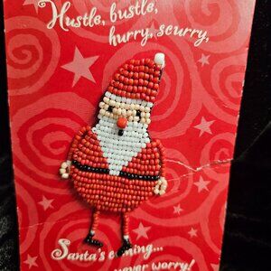 Hallmark beaded Santa pin with moving arms and legs